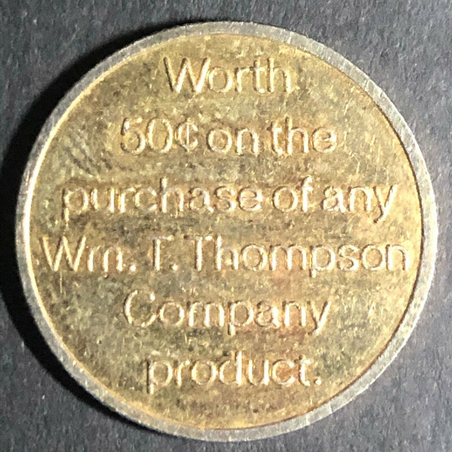 23mm 1985 "Wm. T. Thompson" (Vitamins) 50c off Reeded Brass Token - Fauver Coll.