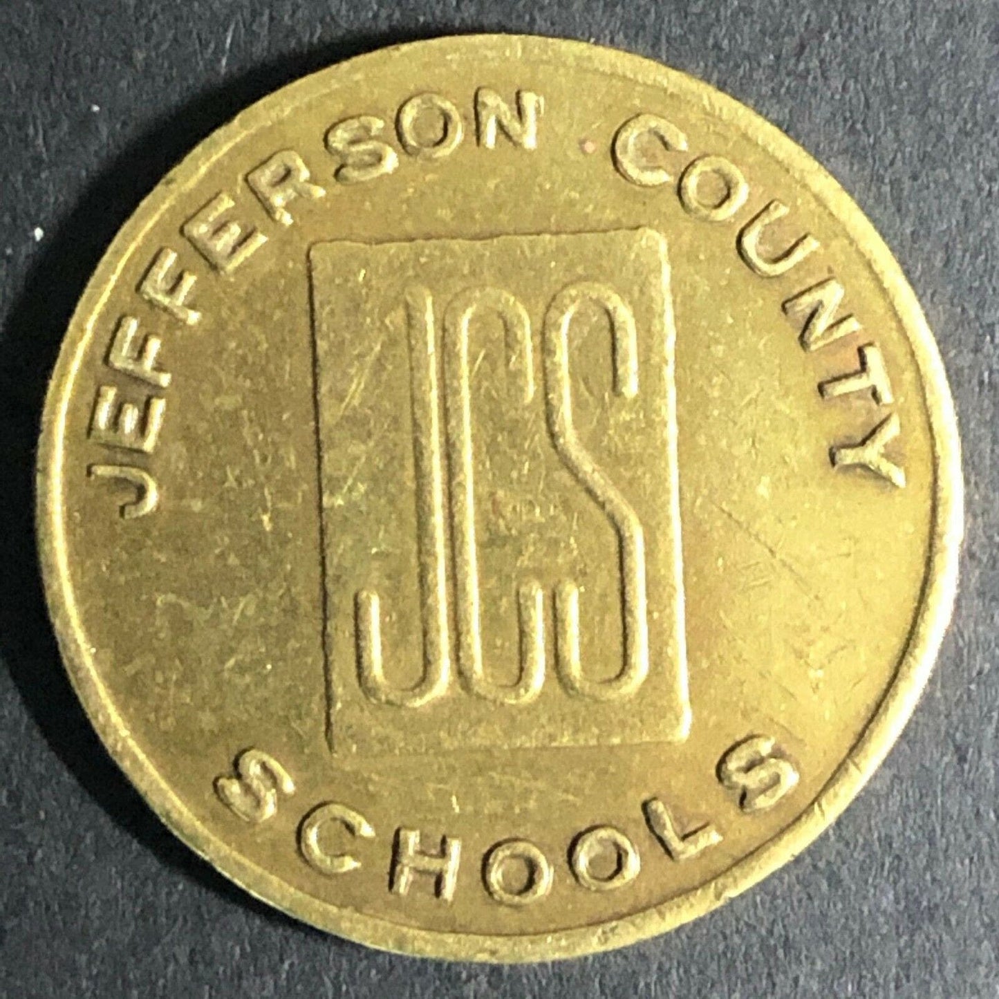 23mm JCS Jefferson County Schools Brass Token - Fauver Coll.