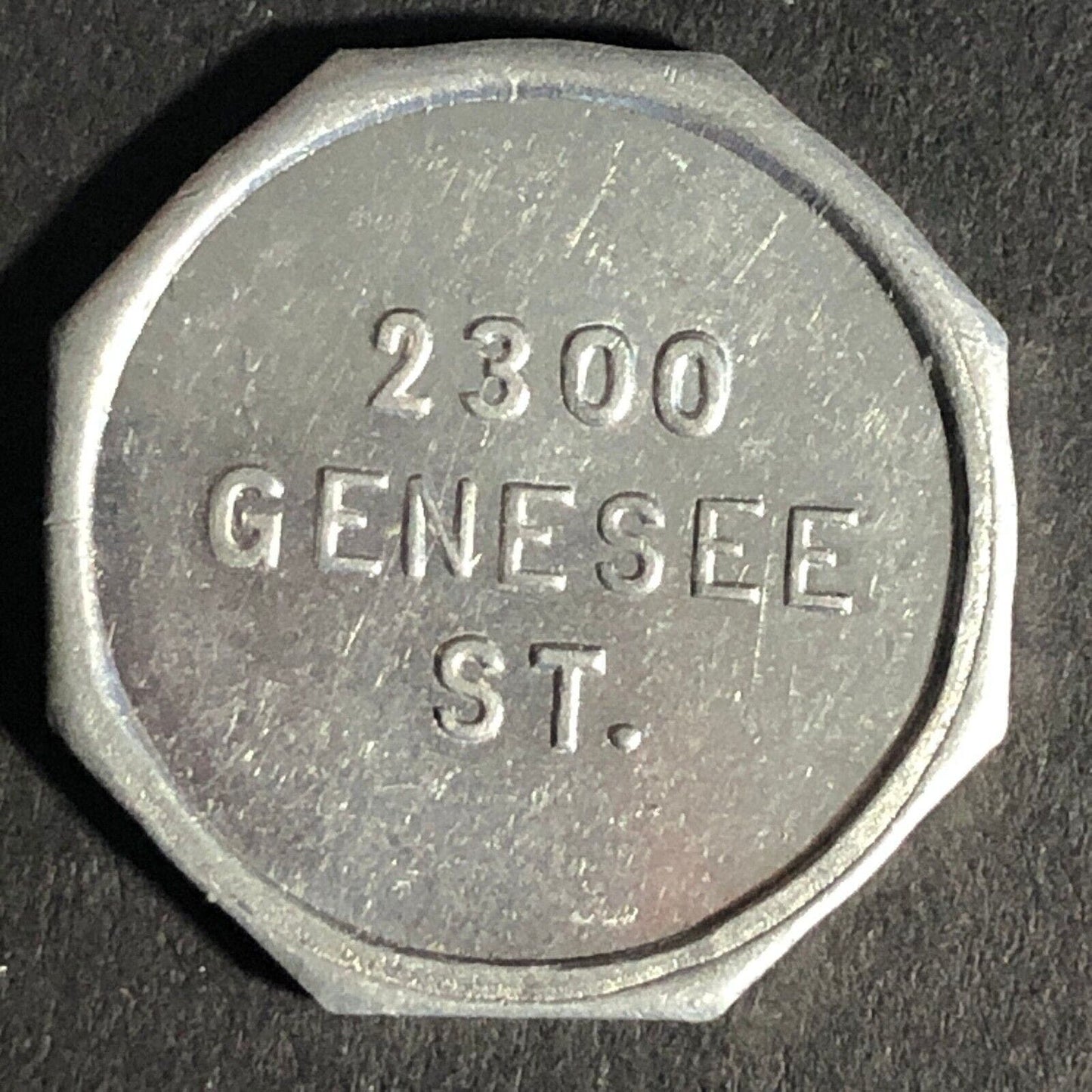 A.C. Gibson Co. 2300 Genesee St. Buffalo Alum. Receipt Token Octagon 22.73mm