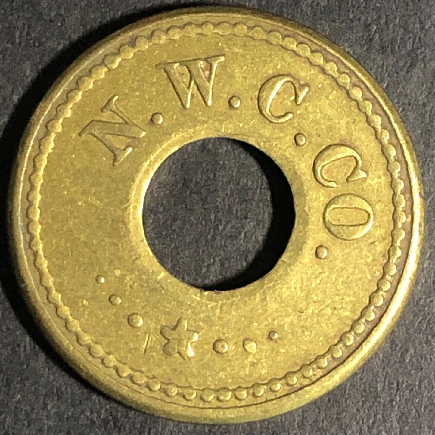 N.W.C. Co. (Seattle Northwestern Candy Co.) Brass 5c Trade Token Donut 21mm
