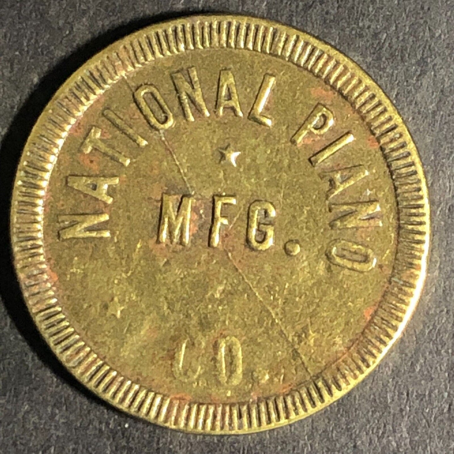 National Piano Mfg. Co. "Good For One Piece Of Music" Brass Token 21mm