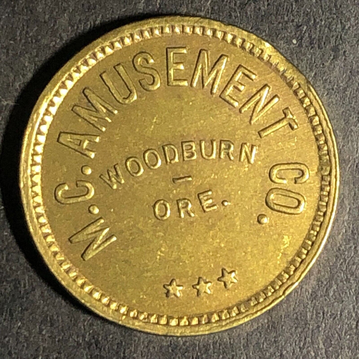 Woodburn, ORE M.C. Amusement Co. Brass Amusement Only" Trade Token 20mm