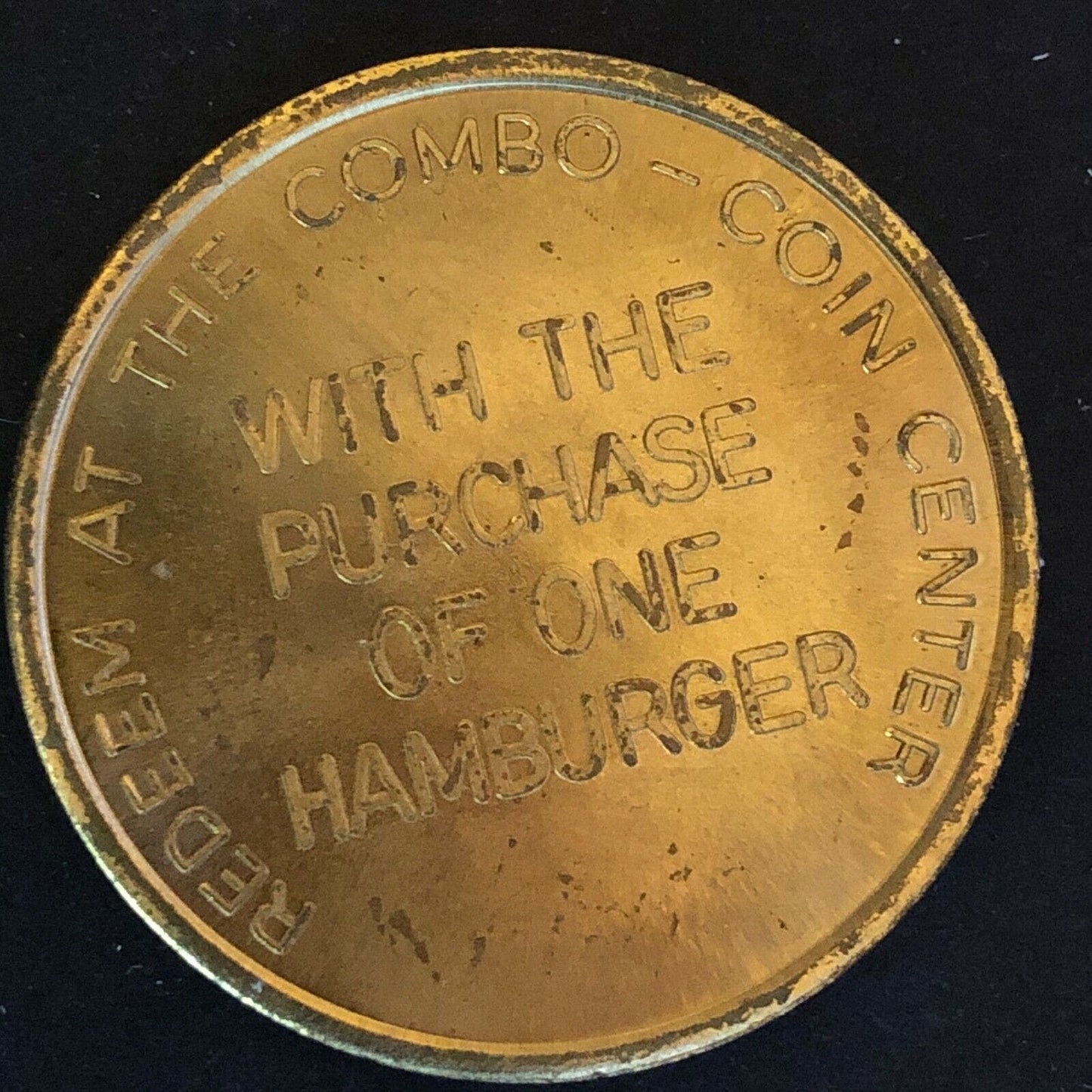 39.50mm Nesbitts "Free Fountain Orange Drink w/ Purchase Of One Hamburger" Token