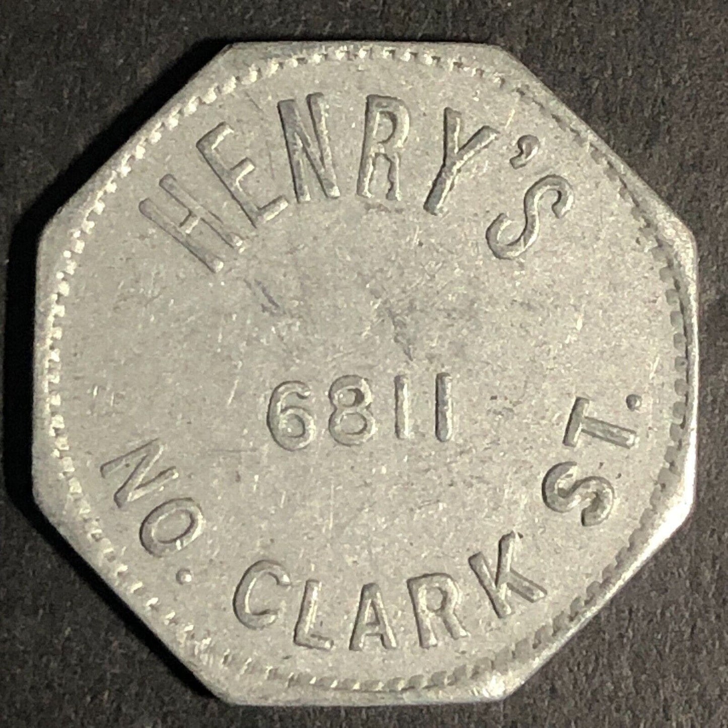 Henry's 6811 No. Clark St (Chicago) Alum G/F 5c Trade Token Hexagon -- 23mm