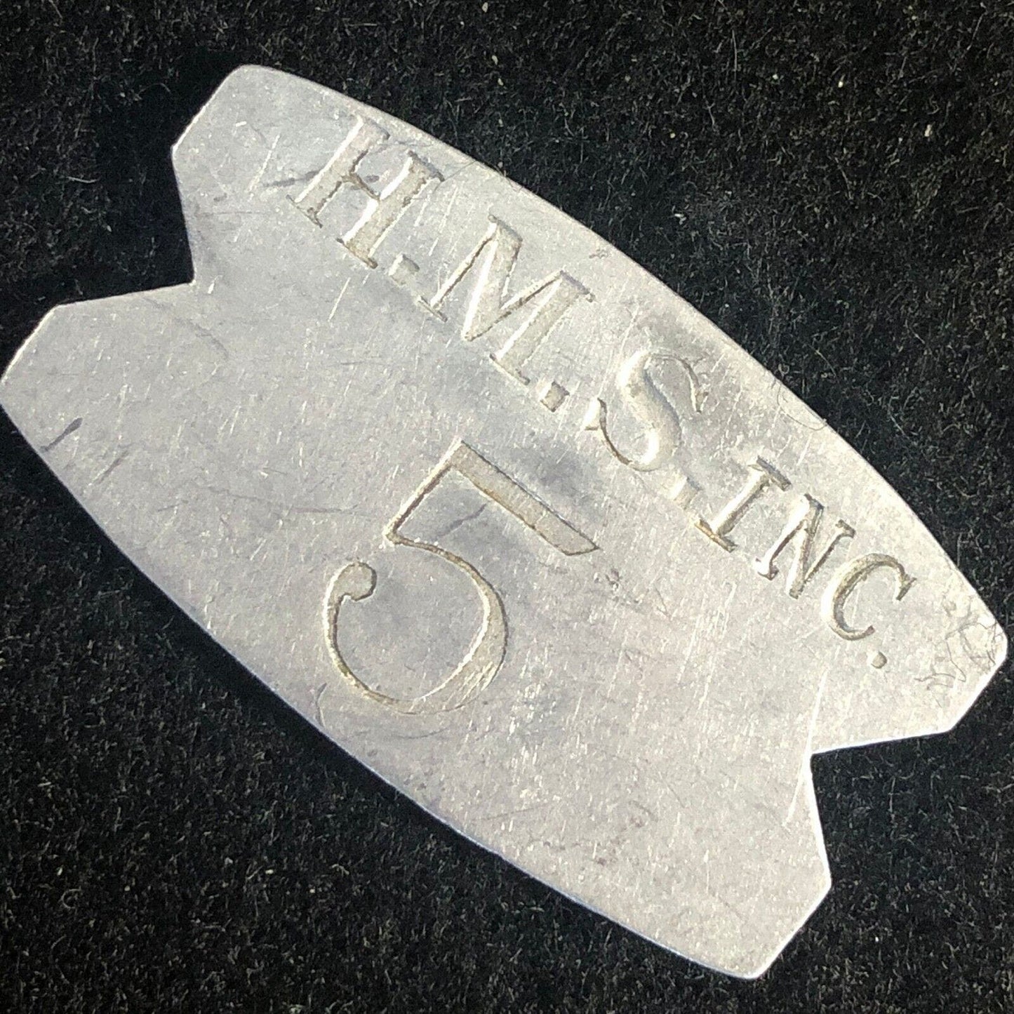H.M.S. Inc. 5 (H. M. Stevens - Churchill Downs) Alum. "Fishtail" Token 22mm x 38
