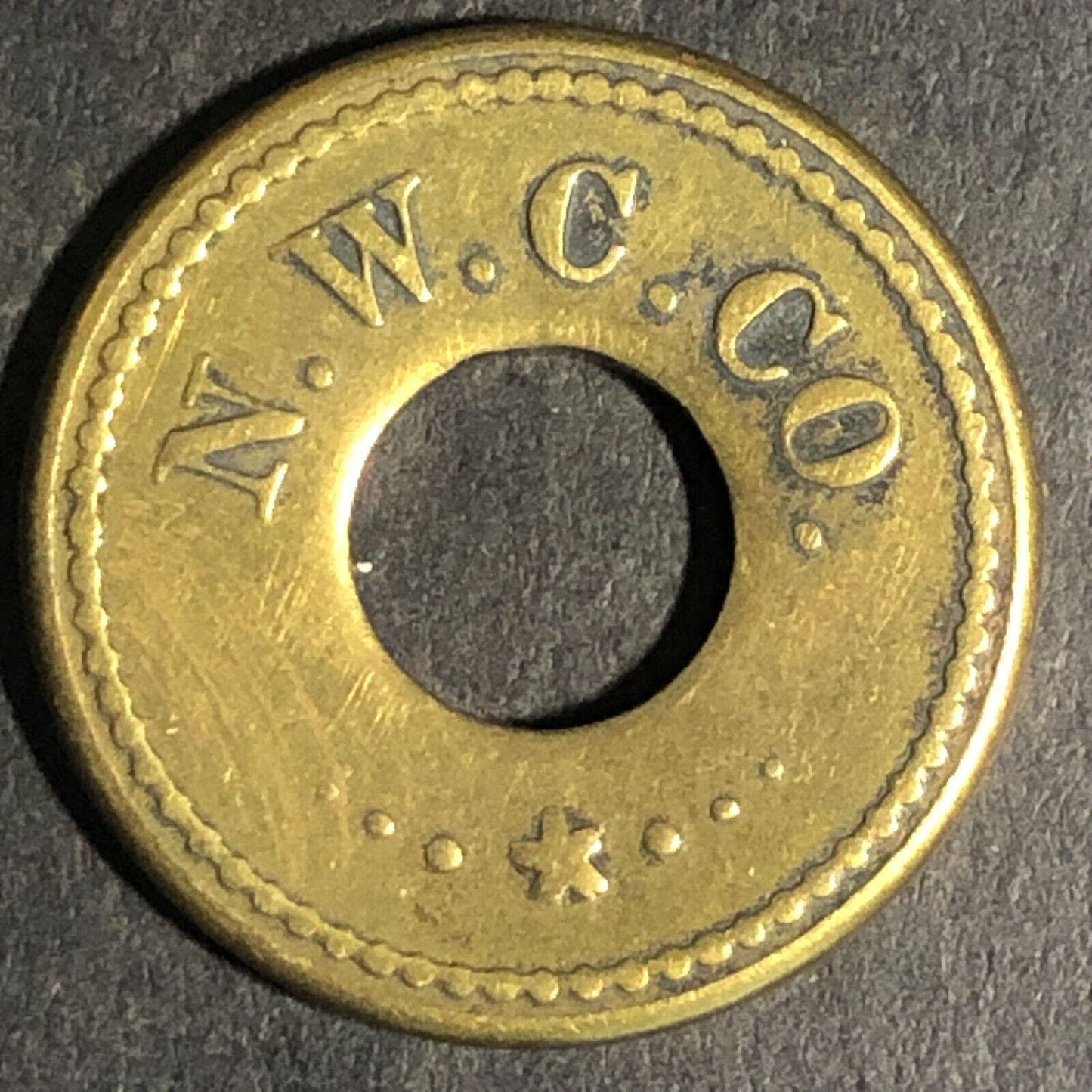 N.W.C. Co. (Seattle Northwestern Candy Co.) Brass 5c Trade Token 21mm