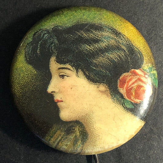 Woman w/ Rose in Hair Steel Celluloid Pinback 1 1/8" c1910's-20's