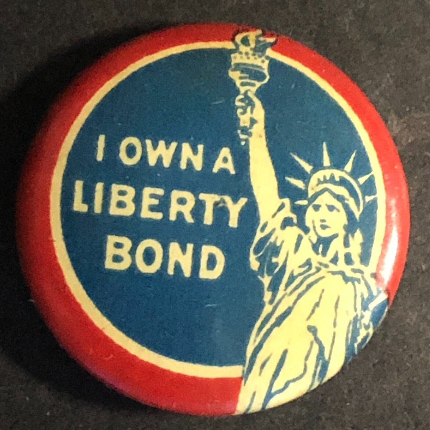 WWI "I Own a Liberty Bond" Statue Celluloid Steel Pinback Button - c1917