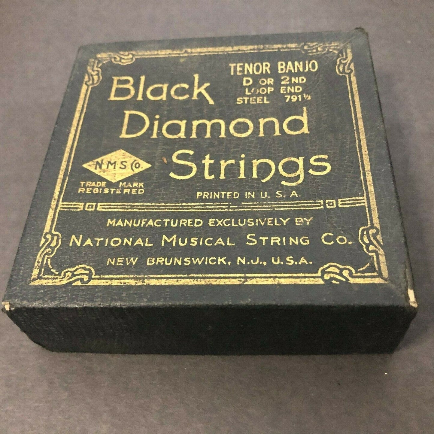 Black Diamond Vintage Banjo String Empty Box Texture + Gilt Text Faux Alligator?