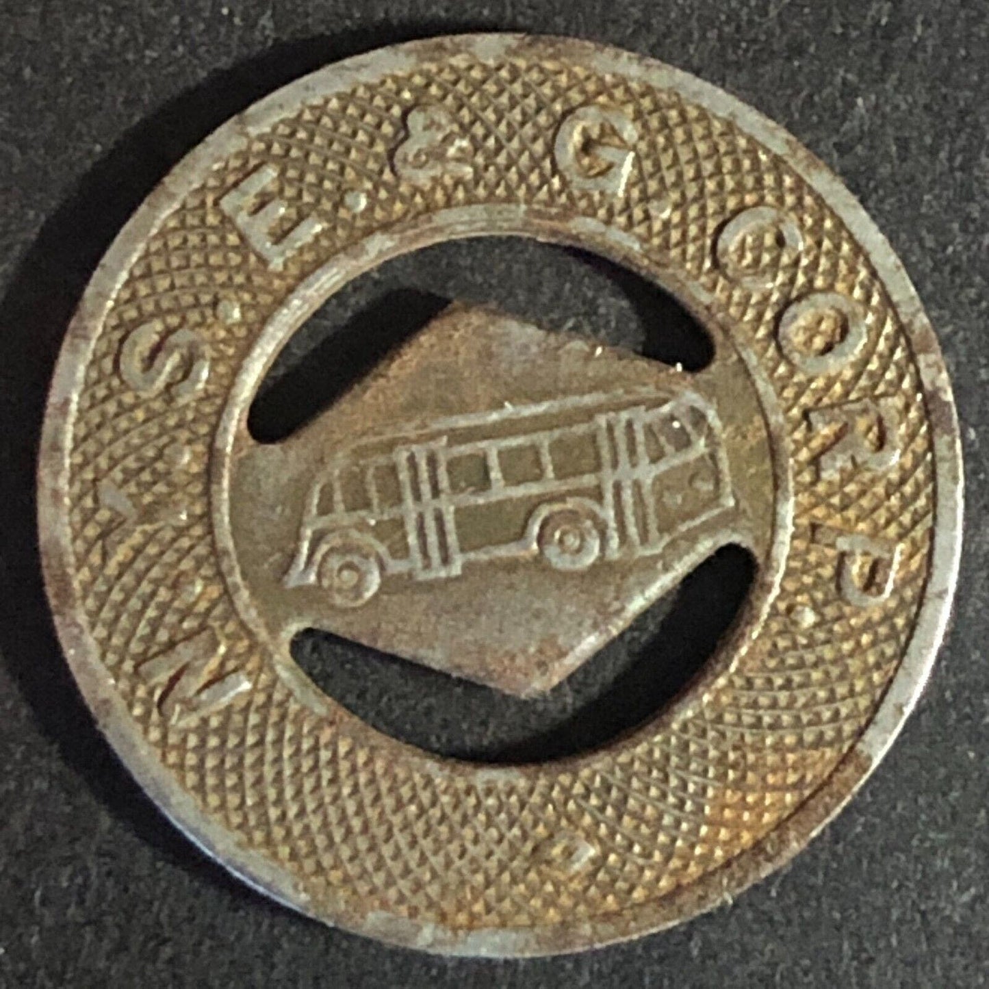N. Y. S. E. & G. Corp. Elmira (NY) Steel G/F One Fare Transit Token 21mm c1944