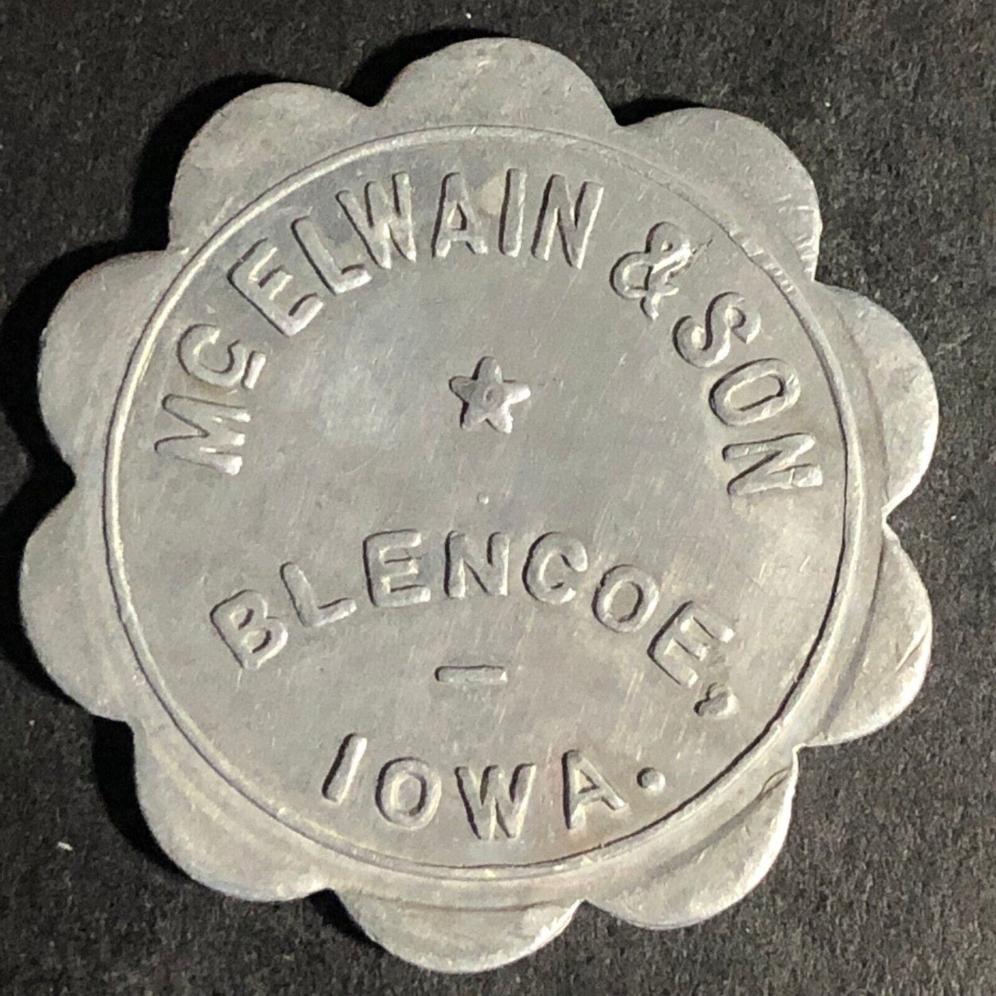 McElwain & Son Blencoe, Iowa G/F 25c Alum Scalloped Token 29.25mm Scarce