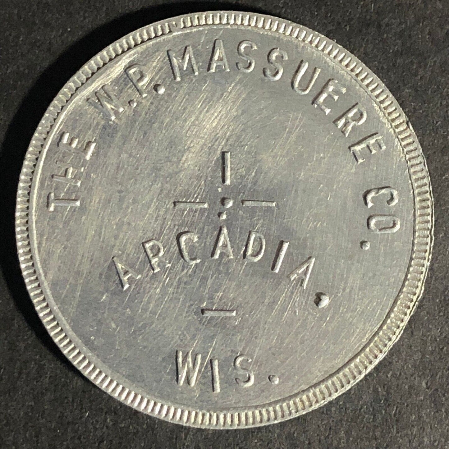 W.P. Massuere Co. Arcadia, Wis. G/F $1 In Merchandise Aluminum Token 31mm