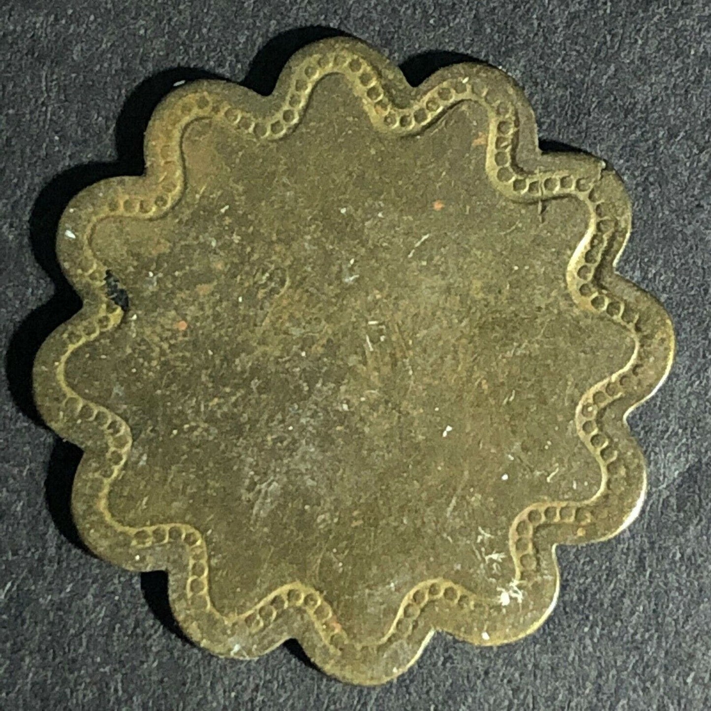 E.L.M. (E.L. McGarity Saloon San Francisco ?) G/F 5c Scalloped Brass Token 25mm