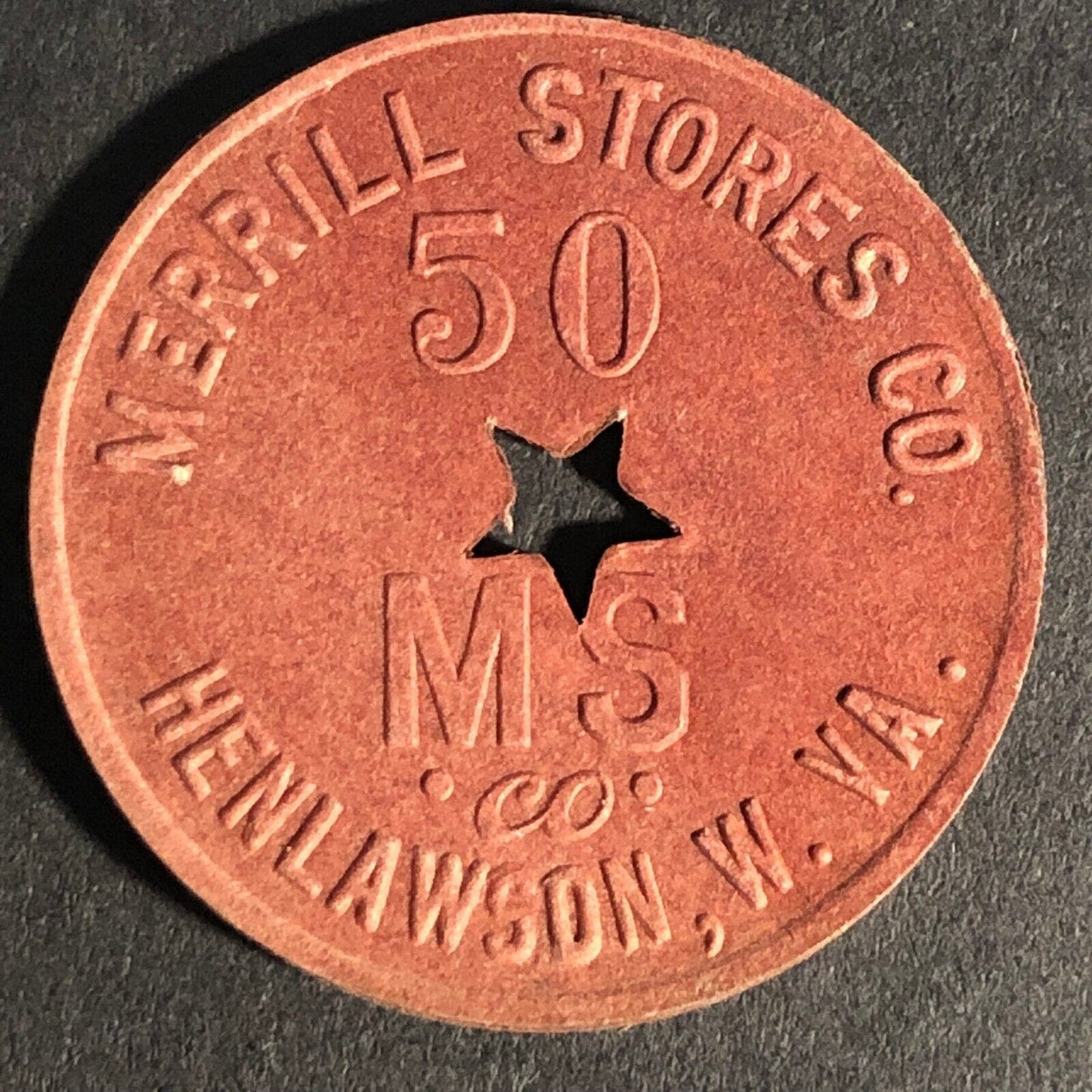 Merrill Stores Henlawson, W. VA Burgundy Red Fiber 50 Token 28.55mm Star Cutout
