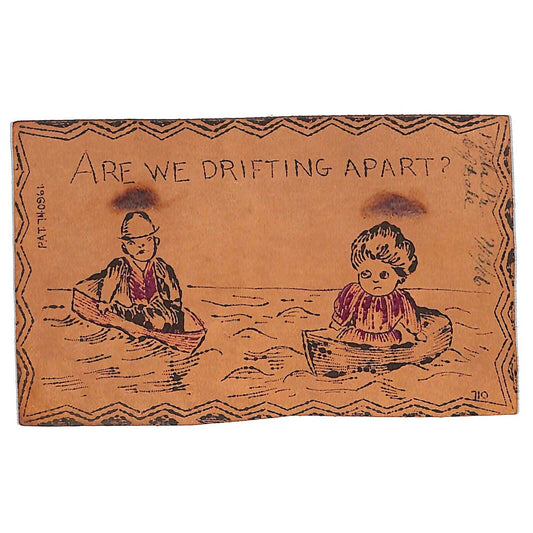 Funny Leather Postcard "Are We Drifting Apart?" Couple in Boats c1906-1908
