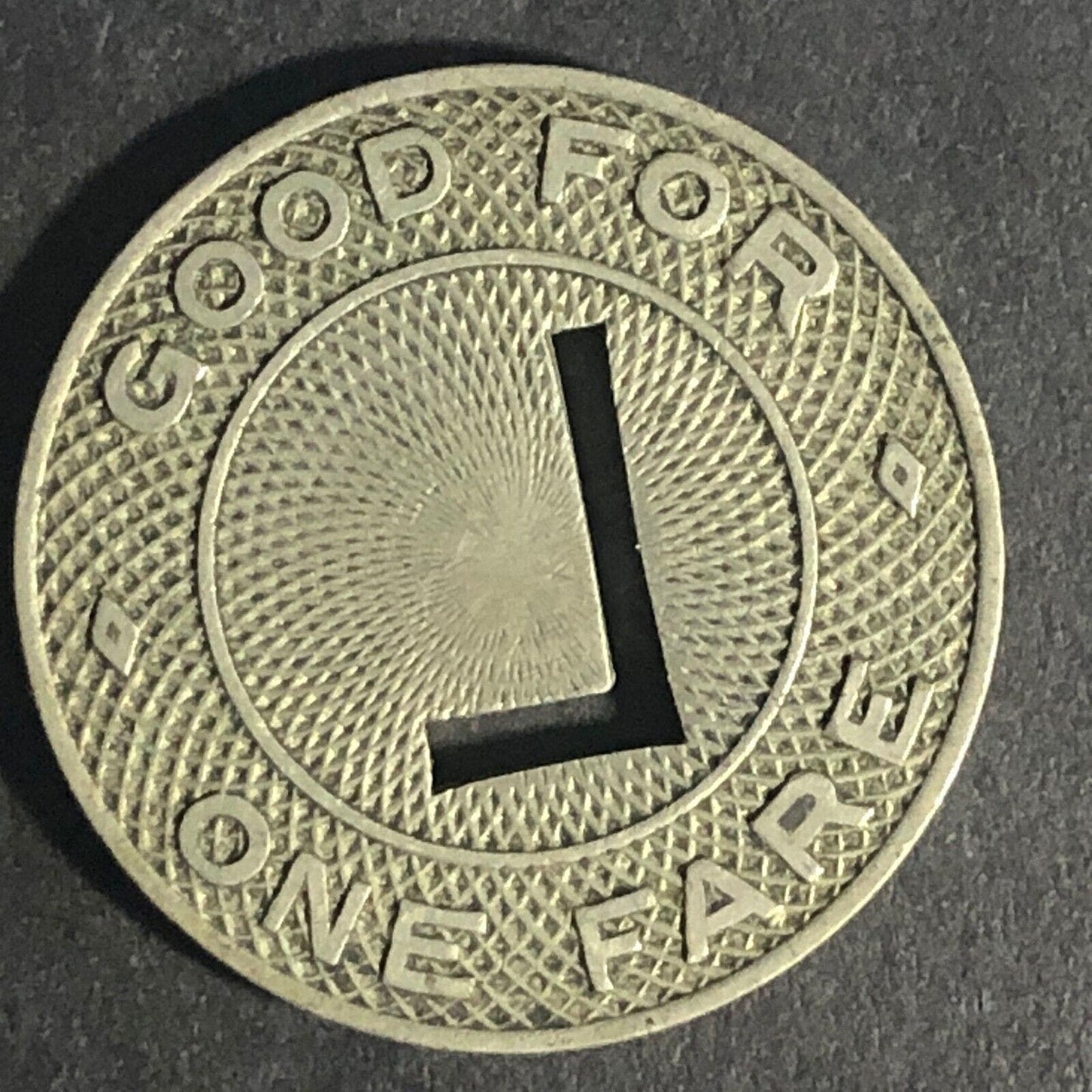 Leppert Bus Lines (Columbia, IN) G/F One Fare WM Token 23mm "L" Cutout