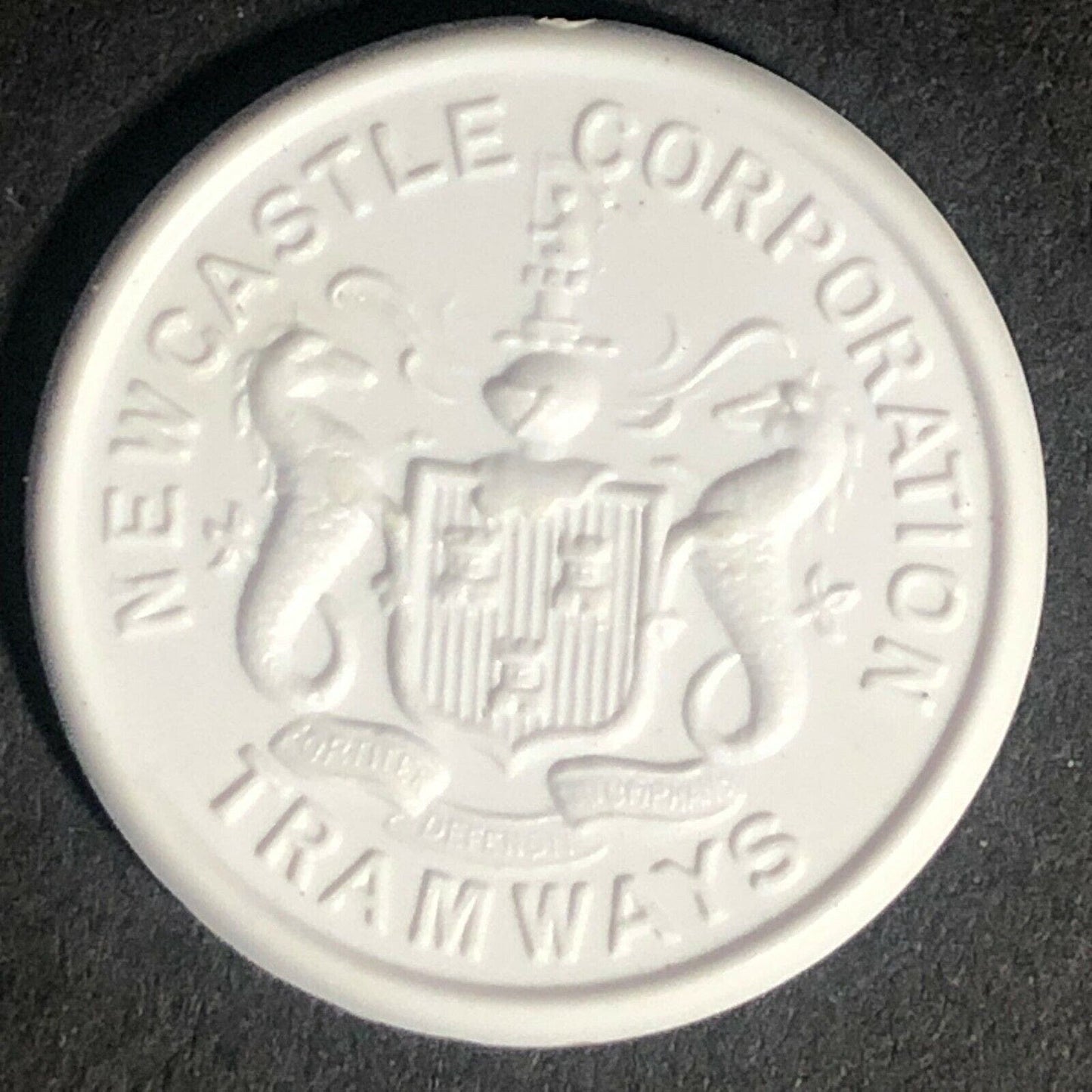 New Castle Tramways England Plastic Transit Token White 4D 21mm c50's-60's