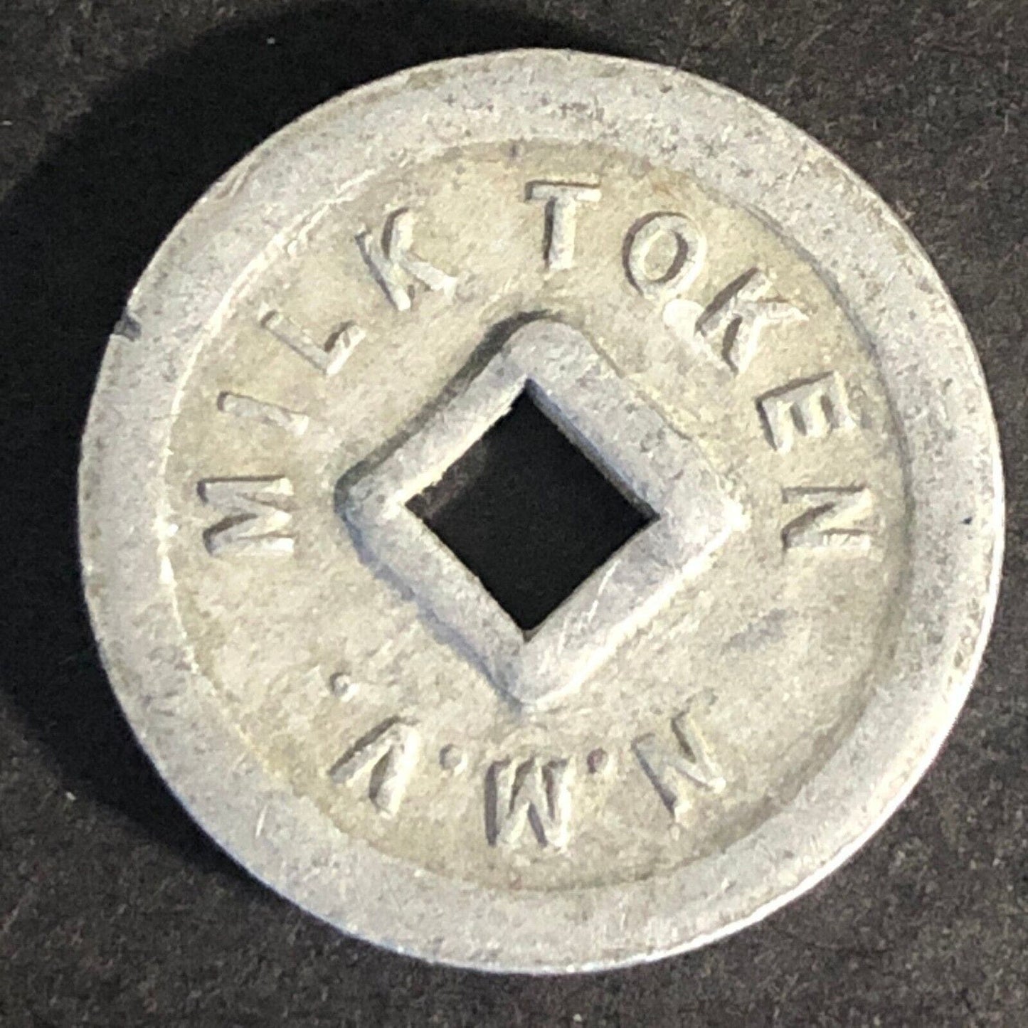 N.M.V. Milk Token Alum. 20mm Scarce (Nelson Milk Vendors New Zealand?)