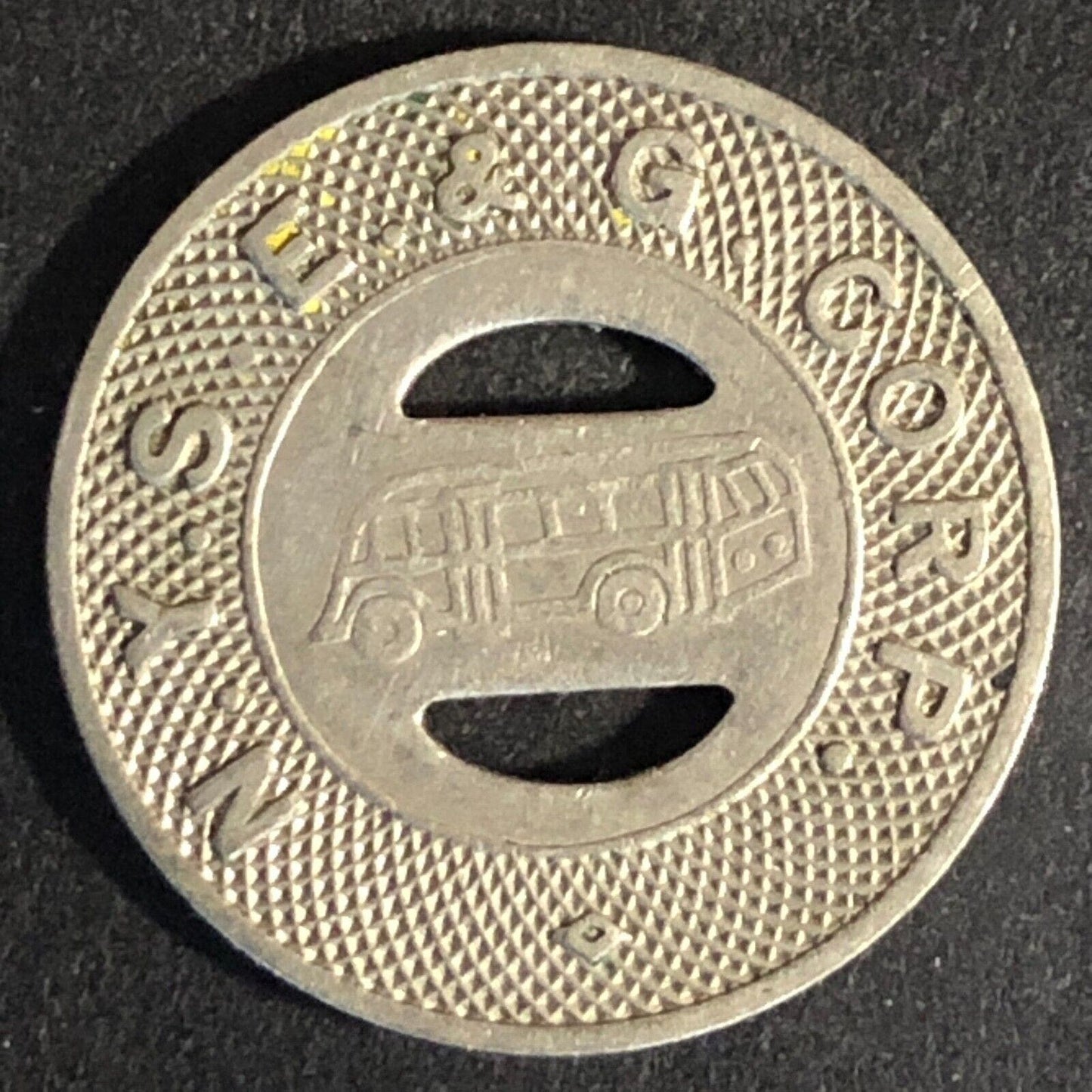 N. Y. S. E. & G. Corp. Elmira (NY) WM G/F One Fare Transit Token 21mm - c1946