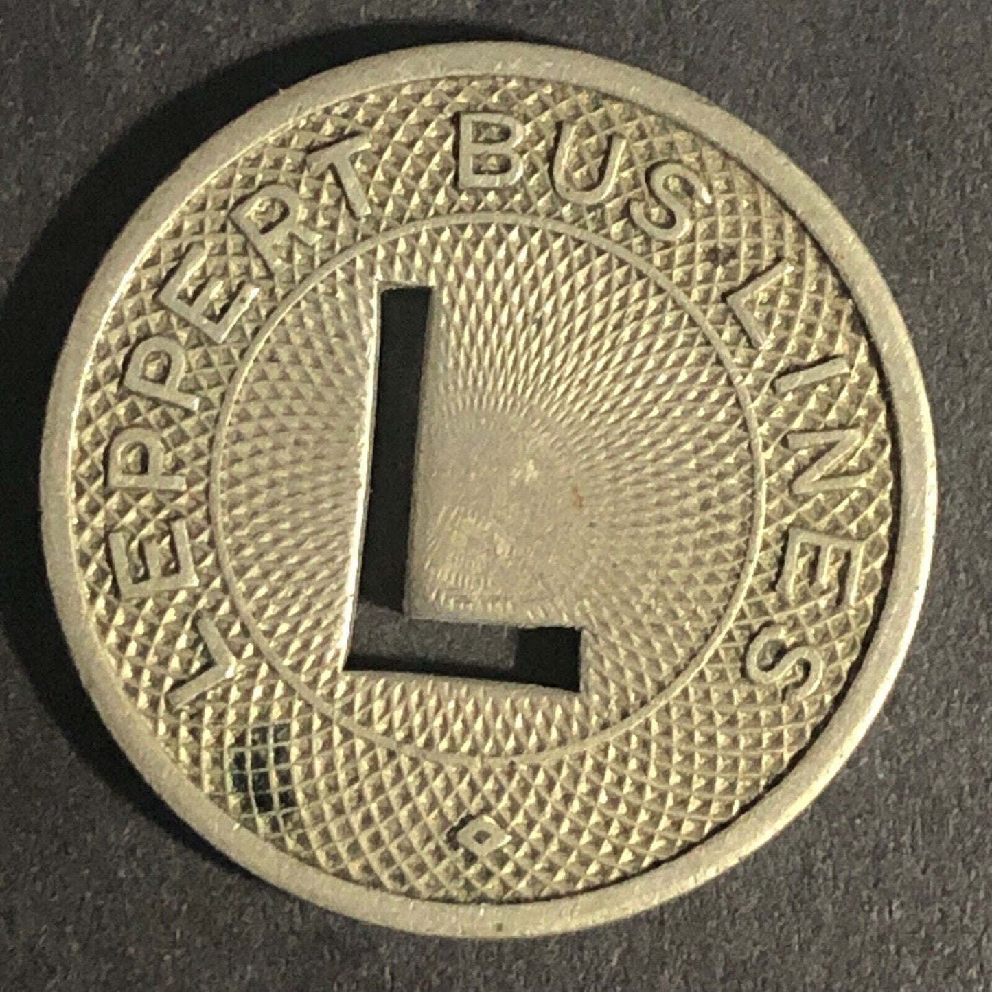Leppert Bus Lines (Columbia, IN) G/F One Fare WM Token 23mm "L" Cutout