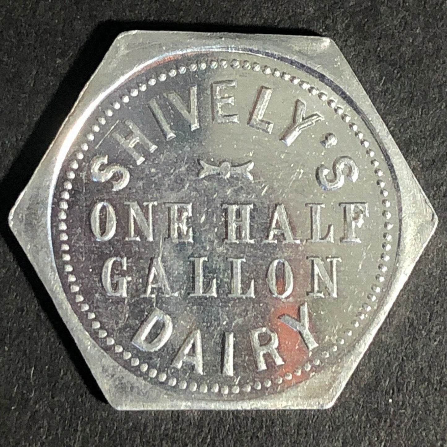 Shively's Dairy Alum Token One Half Gallon 25mm - Hexagonal VGC