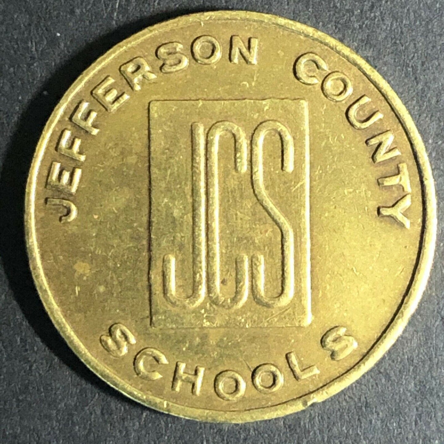 23mm JCS Jefferson County Schools Brass Token - Fauver Coll.