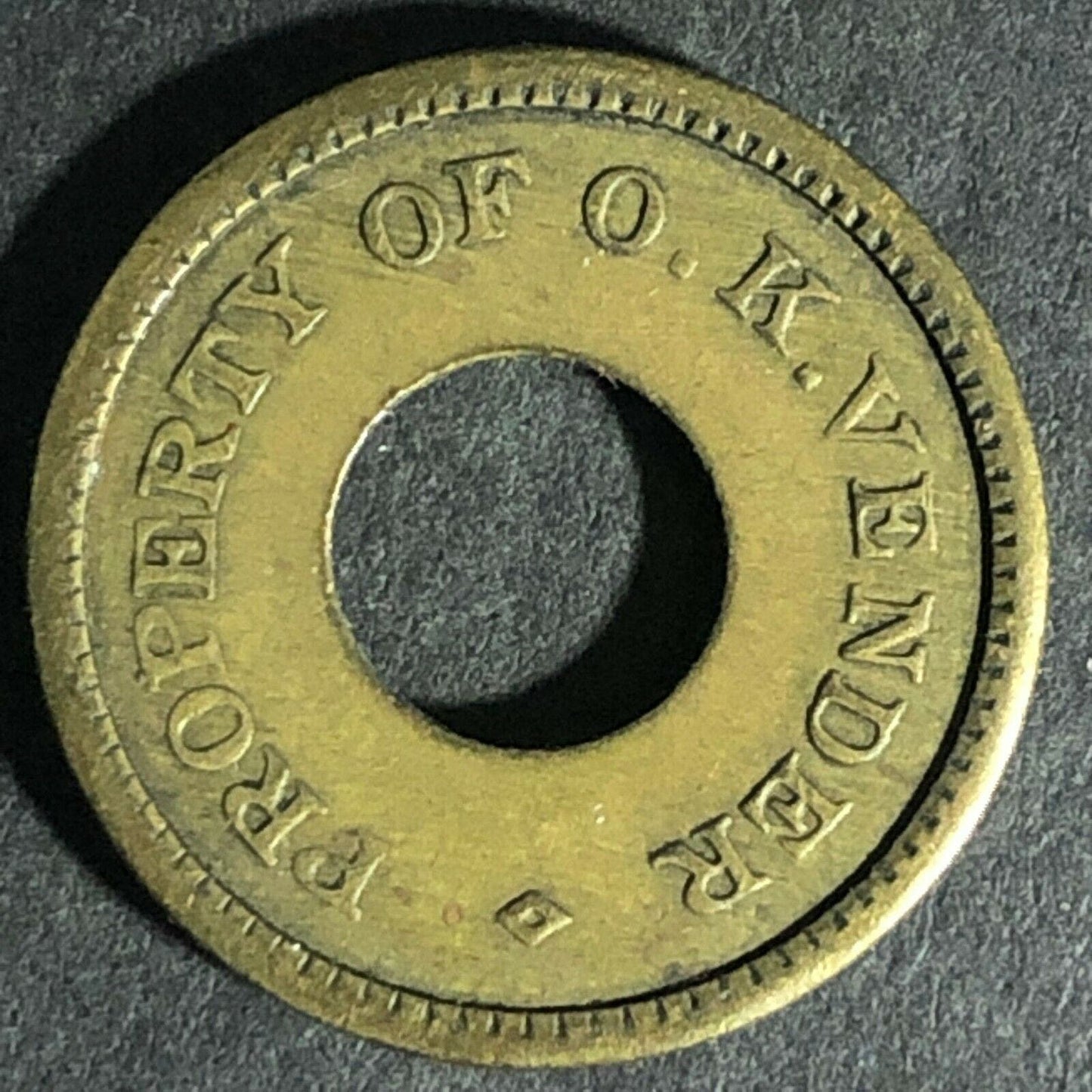 Loaned For Amusement Only - Property of O.K. Vender Brass Donut Token 21mm