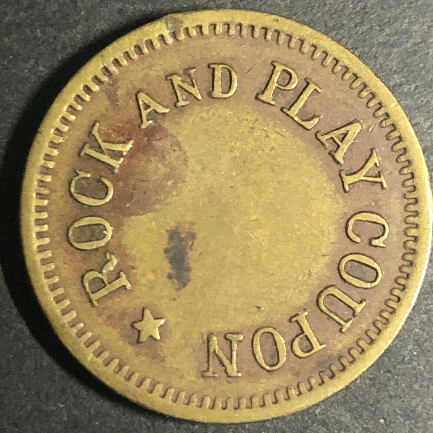 Brass 21.30mm British American Novelty Co. "Rock and Play" Token - Fauver Coll.