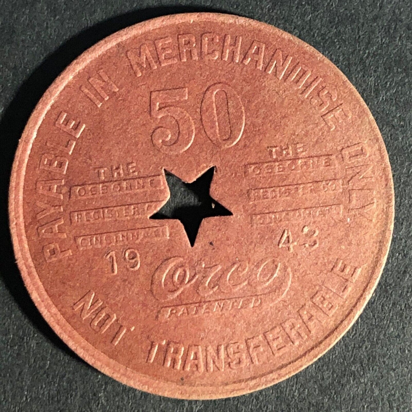 Merrill Stores Henlawson, W. VA Burgundy Red Fiber 50 Token 28.55mm Star Cutout