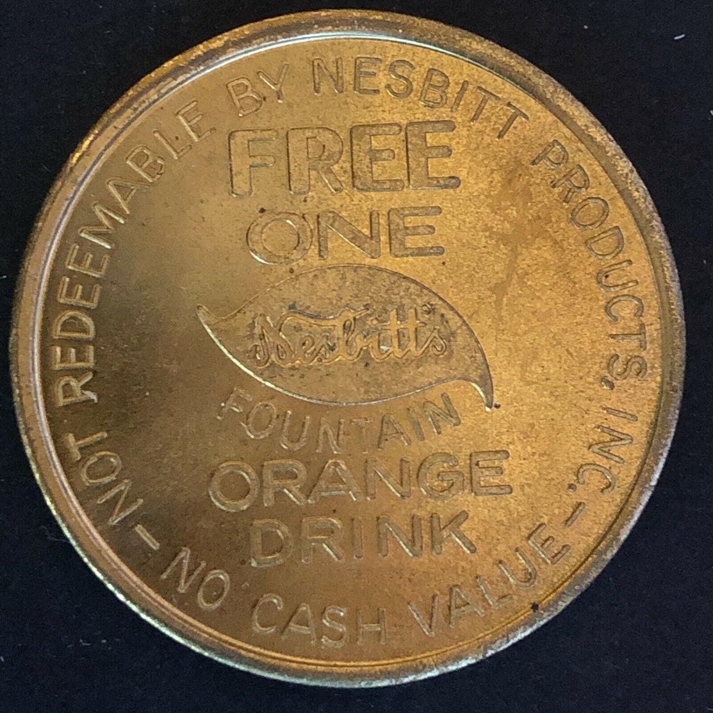 39.50mm Nesbitts "Free Fountain Orange Drink w/ Purchase Of One Hamburger" Token