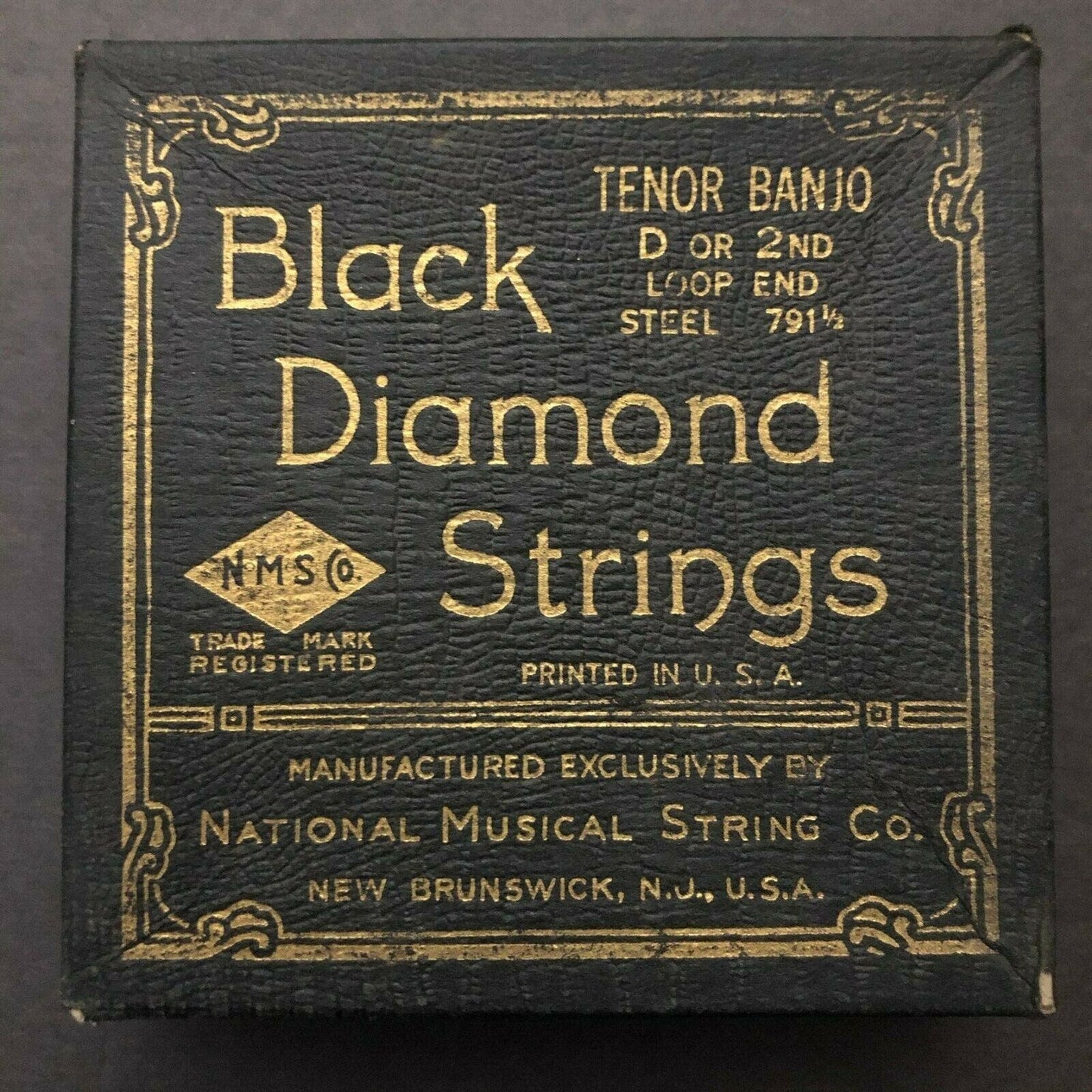 Black Diamond Vintage Banjo String Empty Box Texture + Gilt Text Faux Alligator?