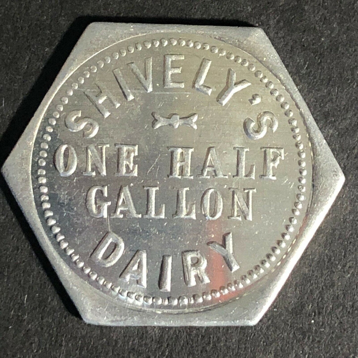 Shively's Dairy Alum Token One Half Gallon 25mm - Hexagonal VGC